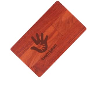 A wooden credit card flash drive in a rich brown hue with a hand logo engraved on its surface.