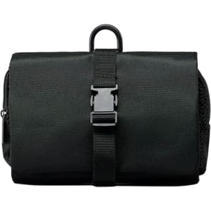 A black folding travel toiletry bag featuring a buckle closure and a hanging loop. It has a textured surface and a zippered compartment.