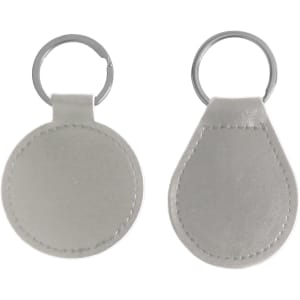 A silver PU leather keyring featuring a round and a teardrop shape, with a metal ring for attachment.