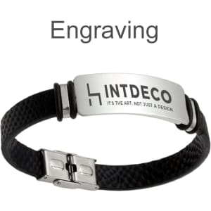 A black engraved leather bracelet with a metallic clasp and an embossed logo.