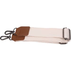 A canvas tote bag strap in beige with brown leather accents and metal clips.