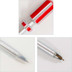 A screwdriver-shaped ballpoint pen in red and silver, featuring a shiny metal tip and a plastic cap.