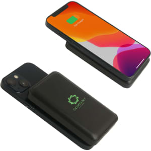 A black magnetic power bank with a logo, paired with a smartphone displaying a colourful screen.
