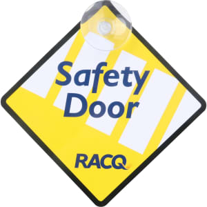 A yellow and black warning sign with the text "Safety Door" and a suction cup attachment. It features a logo.