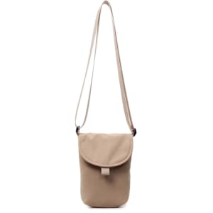 A small sized canvas shoulder bag in a light beige colour with a simple design and adjustable strap.