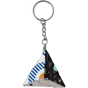A triangular keyring featuring a mix of geometric patterns in blue, black, green, and white.