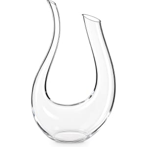 A U-shaped, clear glass wine decanter with elegant curves and a single spout, featuring a logo.