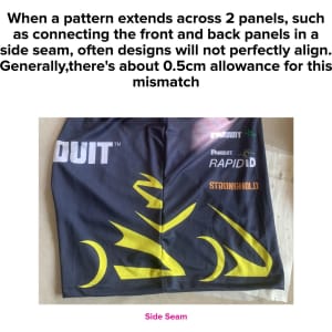 A black sport polo with yellow design elements, featuring a logo and a side seam with a noticeable pattern alignment issue.