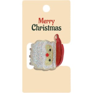 A festive hair claw featuring a glittery Santa design in white and red, presented on a card.