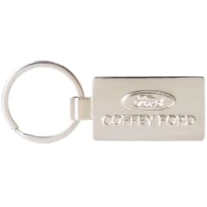 A silver custom-shaped die struck keyring with a logo and branding details.