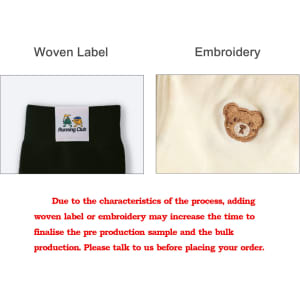 A close-up of two fabric details: a woven label and an embroidered bear, both on a clothing item.