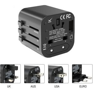 A black travel adapter featuring multiple plug options: UK, AUS, USA, and Euro. Includes a logo on the side.