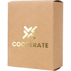 A small square gift box in kraft paper, featuring a gold logo and text on the front.