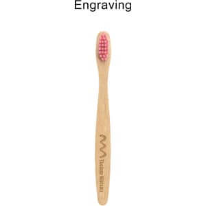 A small bamboo toothbrush with a pink bristle head and a wooden handle featuring a logo engraving.