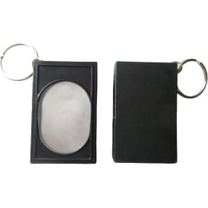 A black pet training clicker with a keychain attachment, featuring a smooth, oval button and a rectangular casing.