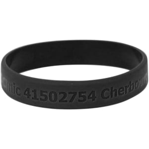 A black silicon wristband with engraved text and a logo, designed for promotional use.