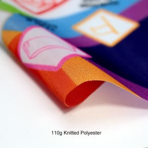 A close-up of a vibrant Body Flag featuring various colours and patterns, made of 110g knitted polyester.