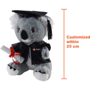 A plush koala wearing a graduation gown and cap, holding a scroll, grey with white accents and a logo on its robe.