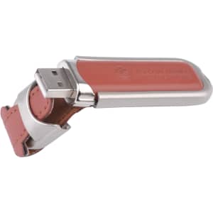 A Taurus flash drive featuring a silver metallic casing with a leather strap in a warm tan colour.