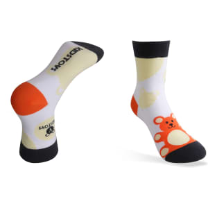 Custom pattern woven socks featuring a playful bear design in white, orange, and black colours. Includes branding.