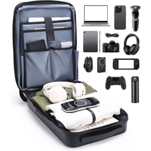 An expandable hardshell backpack in dark blue with compartments for tech items, clothing, and accessories.