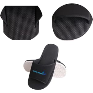 Black EVA slides featuring a textured sole and a logo design on the strap. Suitable for casual wear.