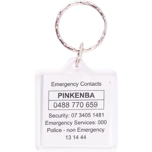 A clear square acrylic keyring with a silver metal ring, displaying emergency contact information.