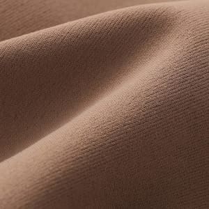A close-up view of a soft, textured fabric in a warm, brown colour.