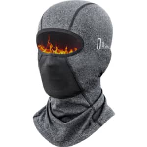 A grey balaclava cycling face mask featuring a mesh eye area and a flame graphic design. It includes a branding logo.