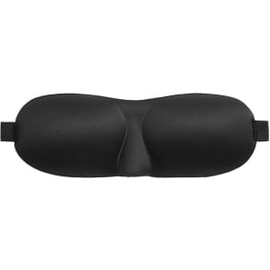 A cushioned eye mask in black, designed for comfort, featuring an elastic strap for secure fitting.