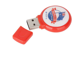 A red round domed flash drive with a logo and a removable cap.