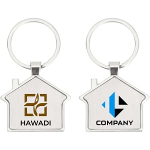 A metal keyring shaped like a house, featuring two logos in brown and blue on either side.