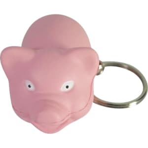 A pink mini pig stress item attached to a keyring, featuring a simple facial design and silver keyring.