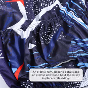 A close-up of a cycling jersey featuring a vibrant blue and abstract pattern, with an elastic hem and waistband.