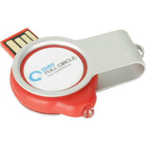 A red and silver epoxy doming light-up flash drive with a circular design and a logo on its surface.