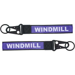 A purple Jacquard keyring featuring a black clip and two keyring loops. It has a branding element.