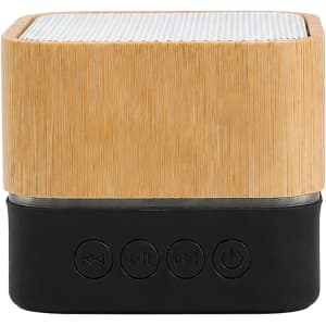 A bamboo Bluetooth wireless speaker with a black base and control buttons at the front. The top features a textured surface.