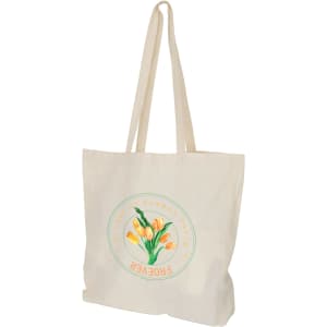 A cream-coloured calico bag with long handles and a floral graphic design, featuring a logo.