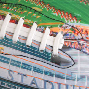 A colourful promotional American football featuring white laces and a detailed design of a stadium.