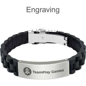 A black silicone bracelet featuring a metal clasp and engraved silver plate, with a logo present.
