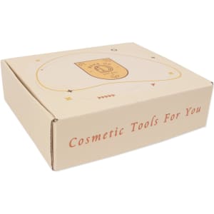 A cream-coloured subscription box featuring a decorative design and a logo, labelled for cosmetic tools.