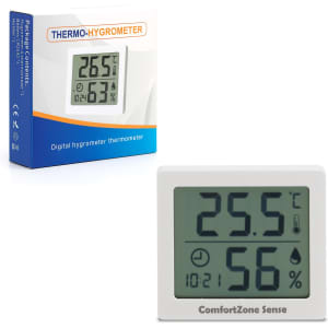 A digital temperature and humidity thermometer in white, displaying measurements, with a packaging box in the background.