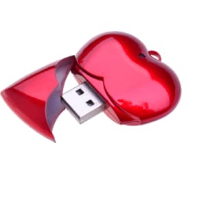 A heart-shaped red USB flash drive with a shiny finish and a removable cap.