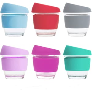 A set of six 8 oz reusable glass coffee cups in blue, red, grey, purple, pink, and teal, each with a silicone lid and sleeve.
