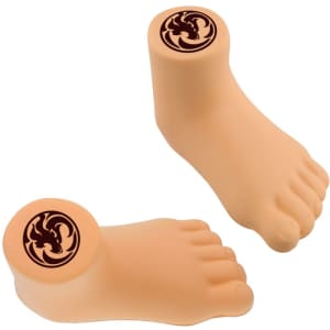 A leg-shaped stress reliever in a peach tone, featuring a circular logo on top.