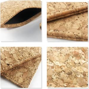 A cork card wallet features natural cork texture, with a black interior and neat stitching along the edges.