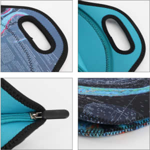 A soft neoprene lunch bag in shades of blue, featuring handles, a zip closure, and a patterned exterior with a logo.