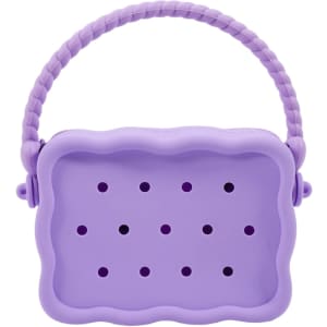 A silicone bag in lavender with a textured handle and perforations, featuring a zip closure and branding.