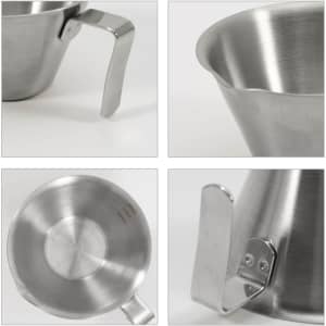 A stainless steel espresso measuring cup with a handle, featuring a smooth, shiny surface and measurement markings.
