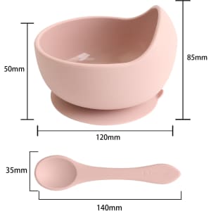 A pink silicone suction bowl with a curved design and a matching spoon, featuring dimensions indicated.
